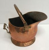 A collection of wood and metal wares to include copper and brass coal scuttles, a blow torch,