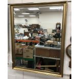 A modern beaded and swept framed rectangular wall mirror with bevel edge plate 99 cm wide x 127 cm