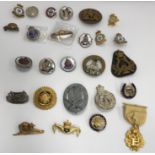 A large collection of military regimental sweetheart brooches/lapel badges to include a 9 carat