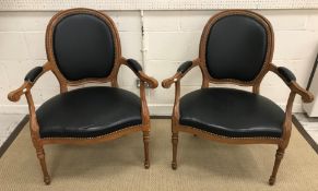 A pair of painted framed swept arm elbow chairs in the Louis XV taste with serpentine fronted seat