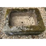 A natural stone rectangular trough height 28cm width 67cm depth 50cm.