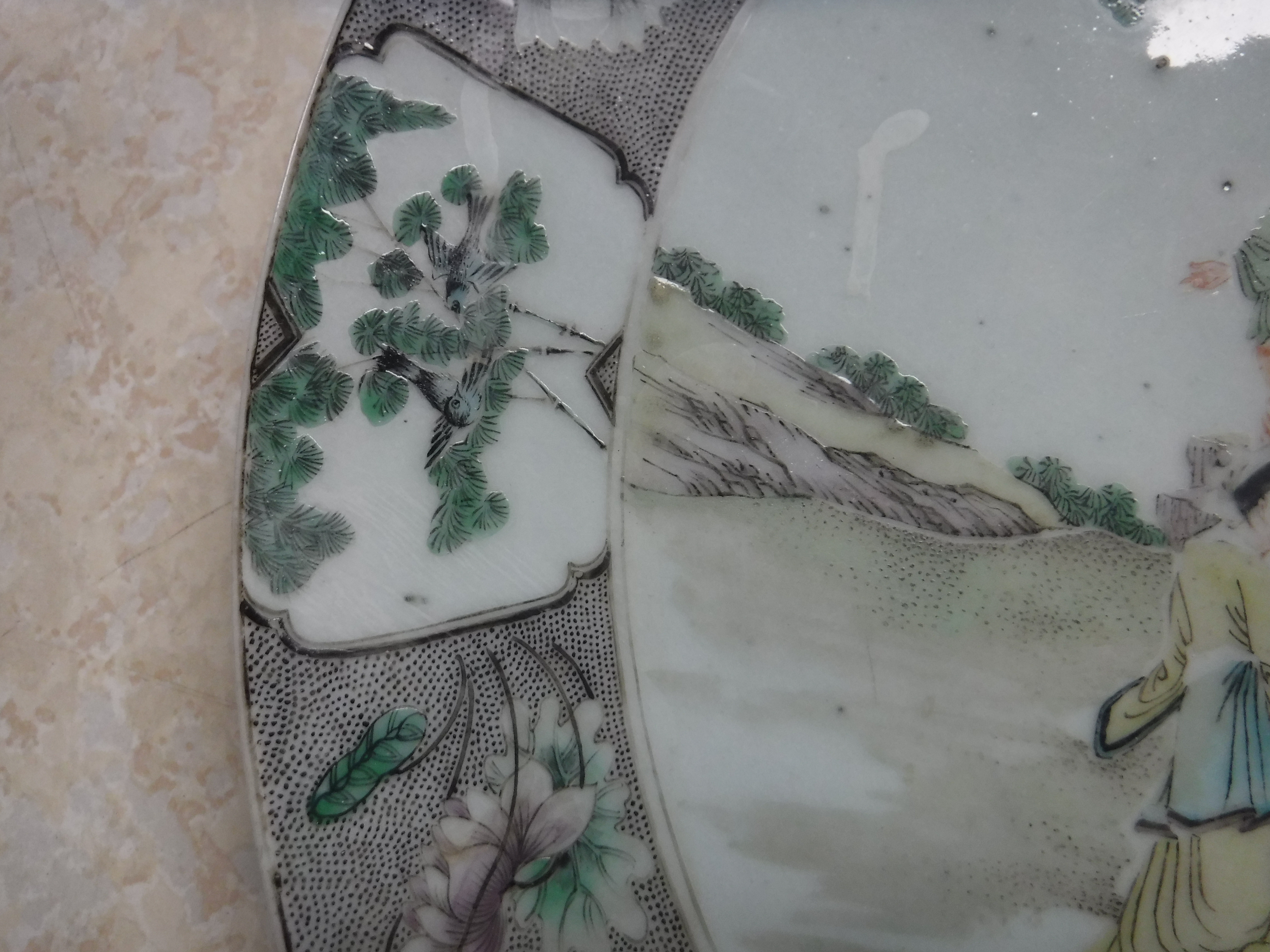 A Kangxi style porcelain charger decorated with figures around a table in a garden setting within a - Image 6 of 14