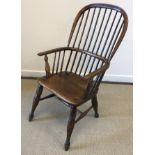 A 19th Century ash and elm stick back Windsor type elbow chair on turned and ringed legs united by