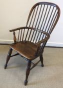 A 19th Century ash and elm stick back Windsor type elbow chair on turned and ringed legs united by