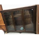 An early 20th Century mahogany glazed three door bookcase 175 cm wide x 30 cm deep x 152 cm high