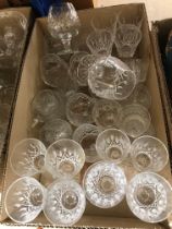 A large collection of glassware to include six Waterford crystal red wine glasses and six matching