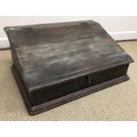 A 17th Century and later oak Bible box, the slope top with iron hinges,