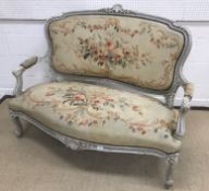 A circa 1900 French carved giltwood and gesso framed two seat salon sofa in the Louis XV style,