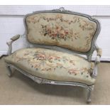 A circa 1900 French carved giltwood and gesso framed two seat salon sofa in the Louis XV style,