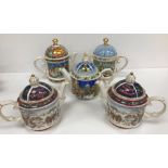 A collection of approximately 40 James Sadler decorative teapots including Sporting Collections,