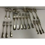 A collection of "Old English" pattern silver cutlery comprising a pair of Georgian tablespoons (by