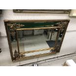 A gilt framed rectangular wall mirror in the Georgian style with multiple bevel edged plates and