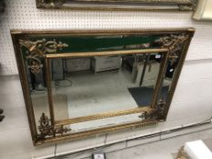 A gilt framed rectangular wall mirror in the Georgian style with multiple bevel edged plates and