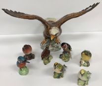 A Beswick figure of "Bald Eagle", No'd, 1018 to base, together with a Beswick "Robin", No'd.