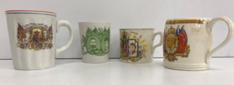 Two boxes containing assorted commemorative mugs, beakers,