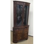 A good quality modern burr walnut veneered free-standing corner cupboard in the Georgian style,