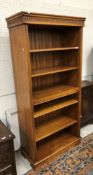 A 20th Century oak open bookcase in the 18th Century style,