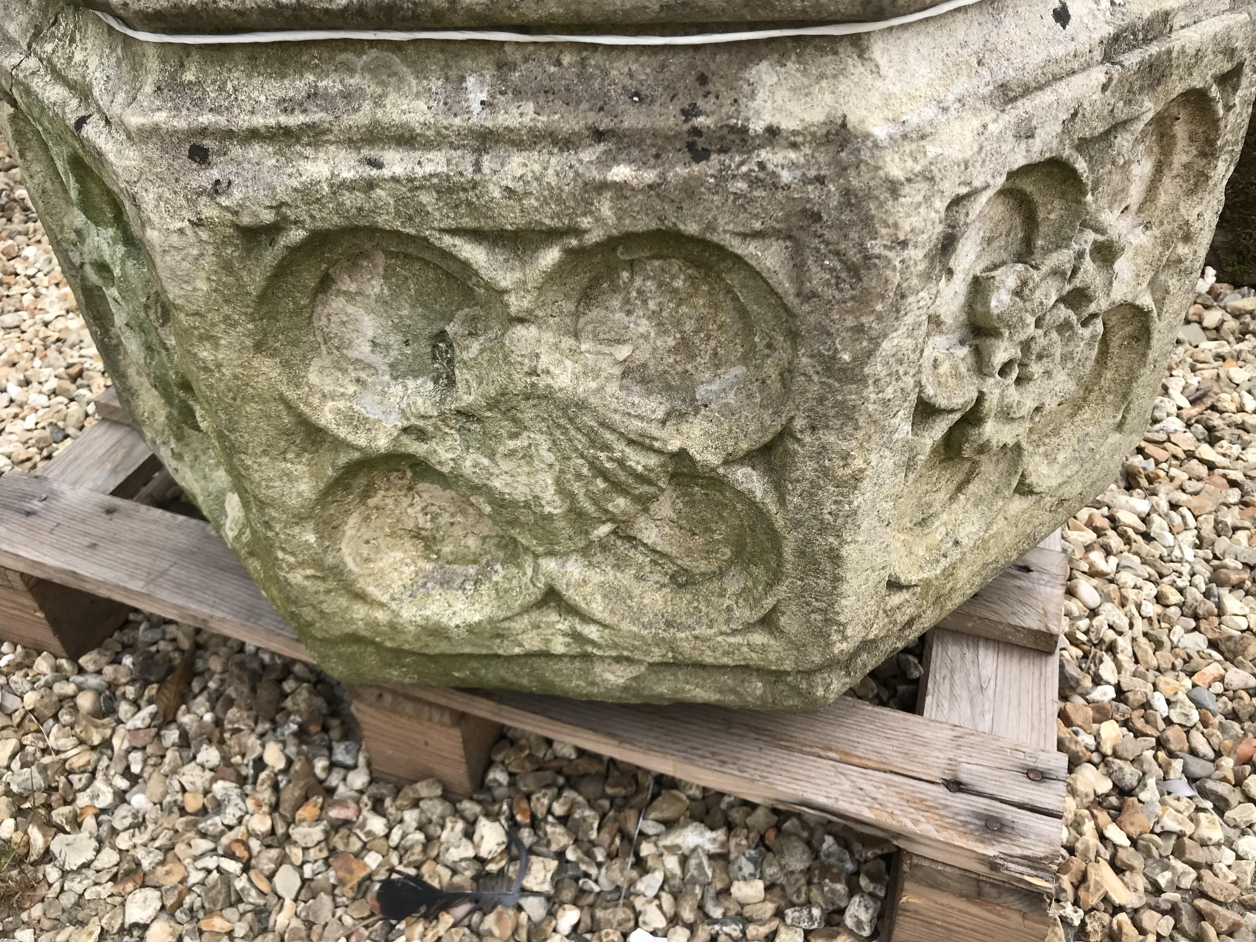 A natural stone font of octagonal form with rose decoration to each side height 45cm width 63cm - Image 6 of 10