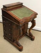 A Victorian burr walnut davenport desk of typical form with stationery compartment above a writing
