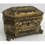 A 19th Century black lacquered and chinoiserie decorated two section tea caddy of bombe form,