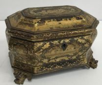 A 19th Century black lacquered and chinoiserie decorated two section tea caddy of bombe form,