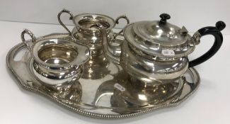 A sterling silver three-piece tea set comprising teapot, 27.15 oz, sugar basin, 3.