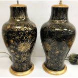 A pair of 19th century Chinese mirror black (Wujin) balaster shaped vases with all over scrolling