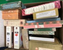 A box containing a collection of vintage and later jigsaw puzzles including Victory artistic jigsaw