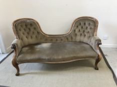 A Victorian carved walnut framed button back double spoon back sofa,