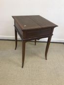 A circa 1900 mahogany and inlaid Sheraton Revival writing table by Maple & Co.