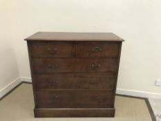 A Victorian mahogany and inlaid chest of two short over three long drawers, raised on a plinth base,