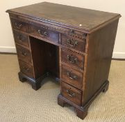 A George III mahogany kneehole writing table or desk,