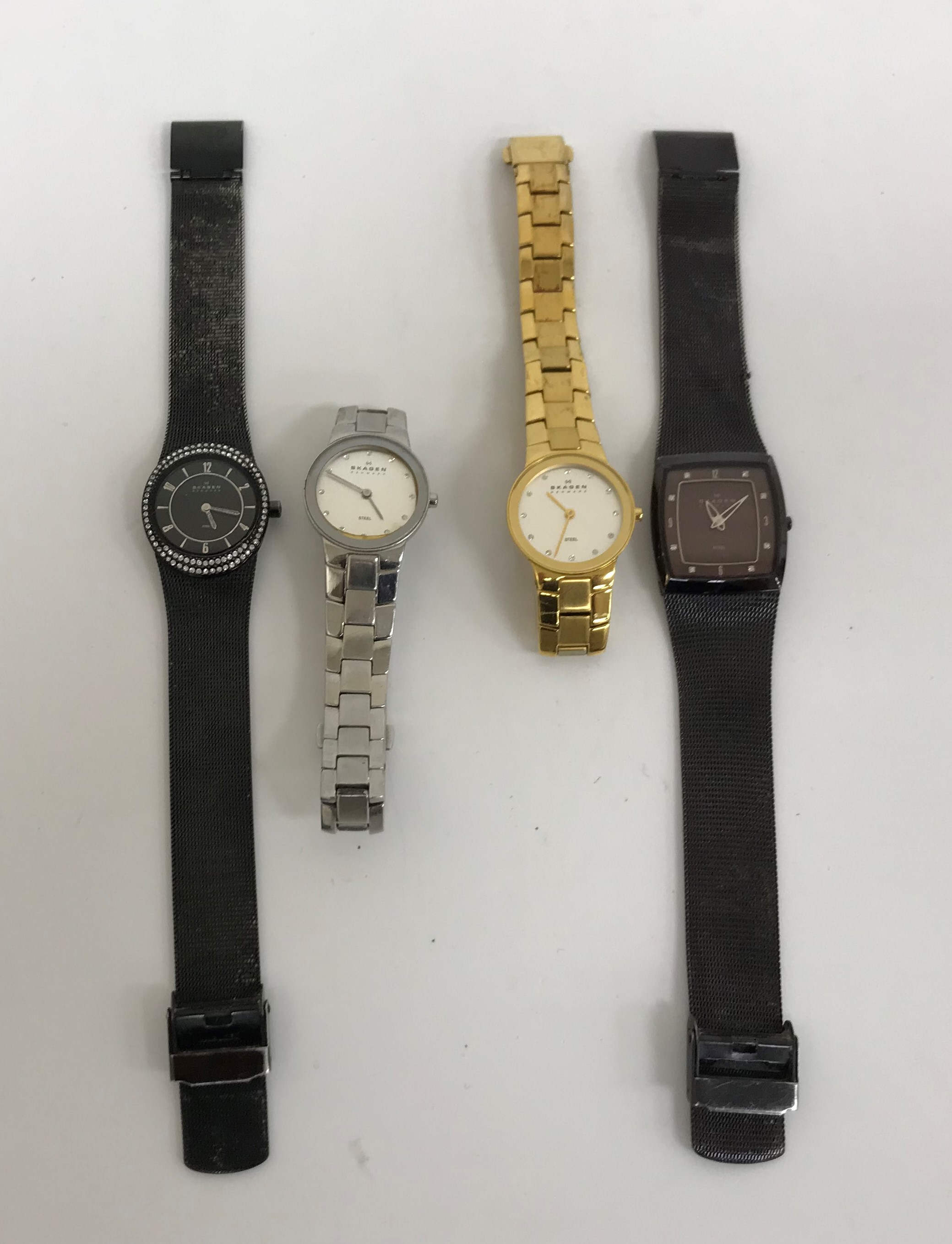 A collection of four Skagen Denmark wristwatches