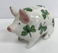 A Wemyss pottery pig with all over green clover decoration,