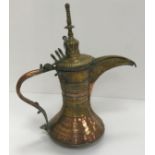 A collection of Middle Eastern and other copper wares to include two Turkish coffee pots,