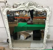 A Victorian giltwood and gesso framed overmantel mirror with scrolling acanthus and floral