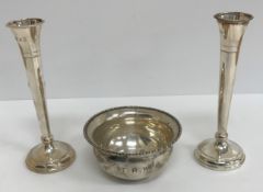 A silver bowl of plain form with applied rim, inscribed "TRW" (by Josiah Williams & Co,