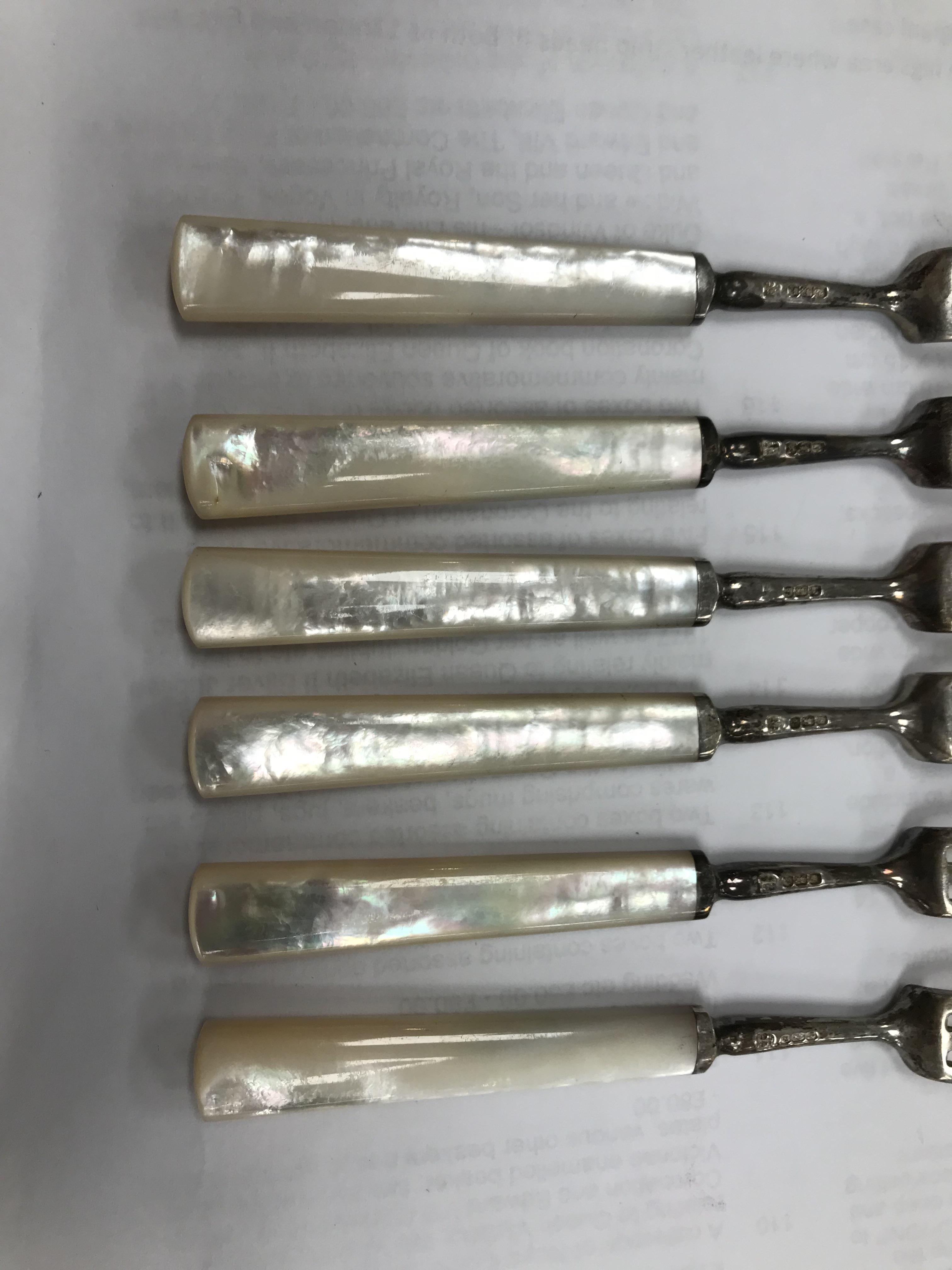 A cased set of six silver bladed and tined mother of pearl handled fruit knives and forks (by James - Image 7 of 26