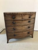 A Victorian mahogany bow fronted chest of two short over three long drawers,