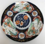 A Meiji period Japanese Imari charger with decoration of panels of mandarin ducks and flowers