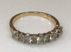 A 9 carat gold diamond set dress ring of band form, the total carat approx 0.6, size P, 2.