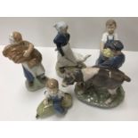 A collection of five various Royal Copenhagen figures including "Boy with calf" (772),