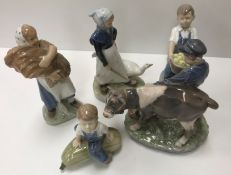 A collection of five various Royal Copenhagen figures including "Boy with calf" (772),
