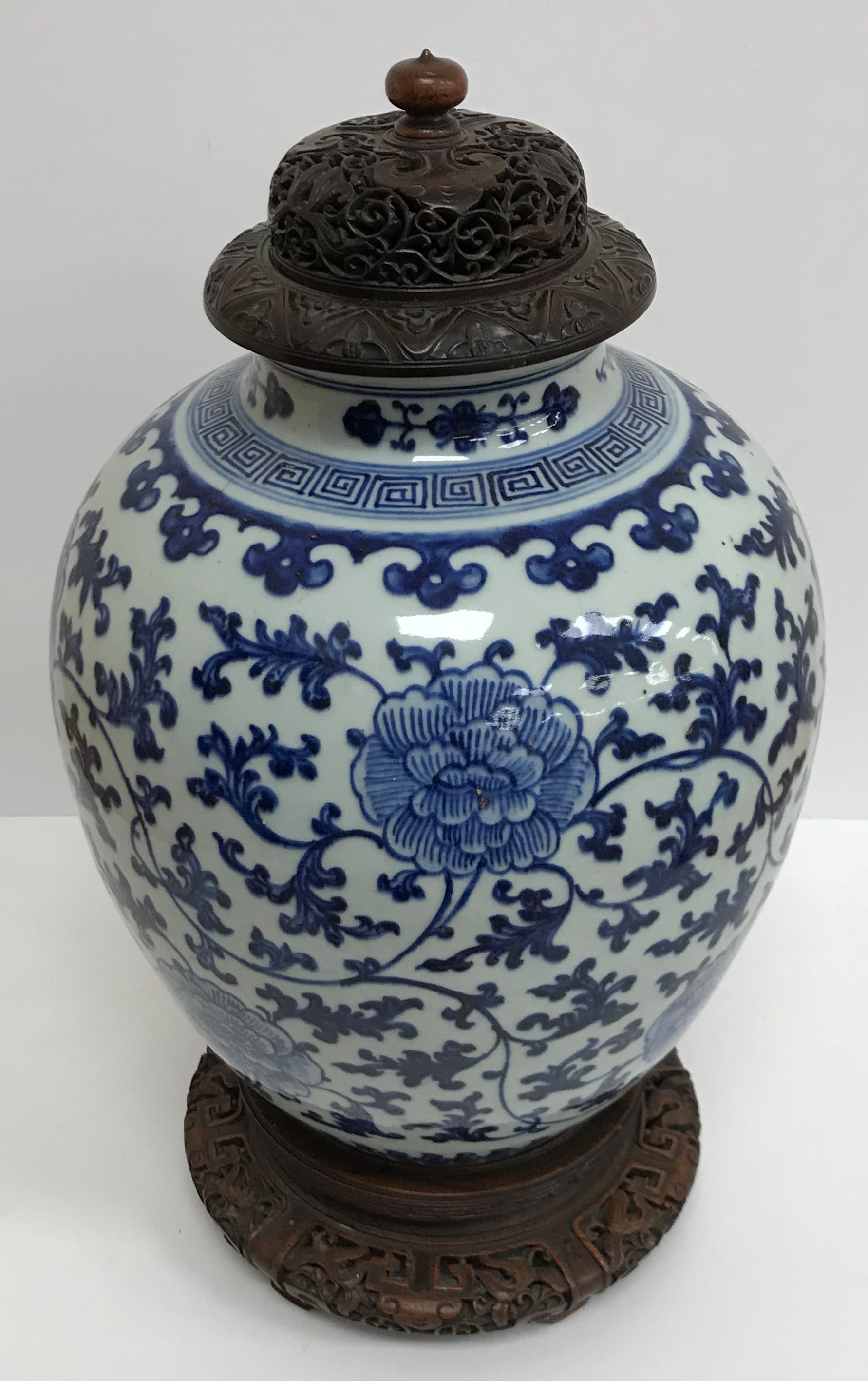 A 19th Century Chinese blue and white vase with all over foliate and floral decoration, 32.