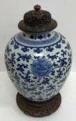 A 19th Century Chinese blue and white vase with all over foliate and floral decoration, 32.