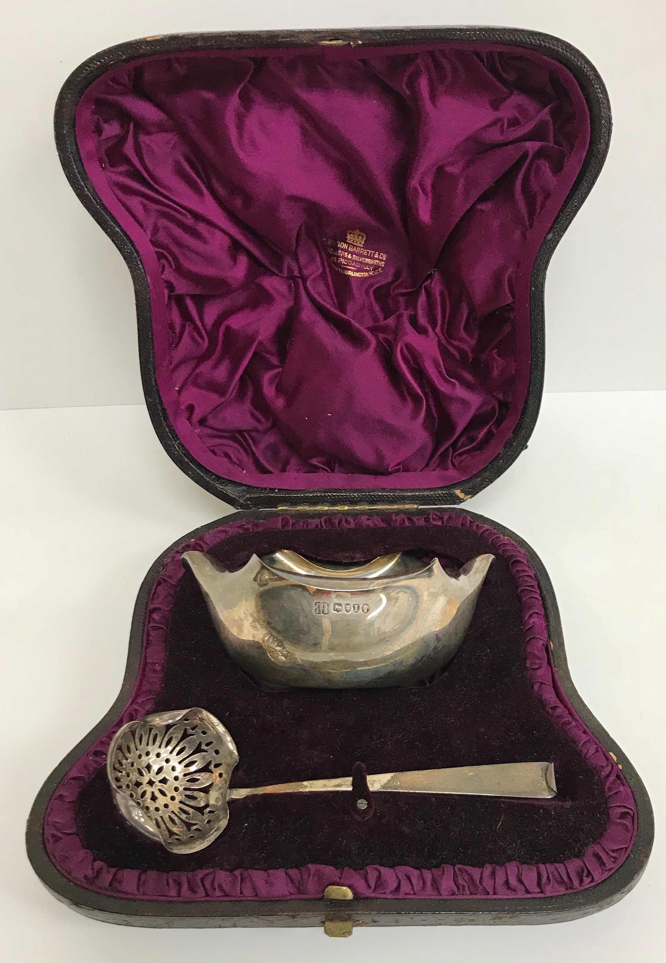 A Victorian cased silver sugar bowl and sifter spoon (by Jonathon Wilkinson Hukin and John Thomas