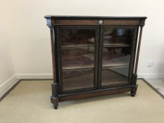 A Victorian ebonised and amboyna banded glazed two door side cabinet,