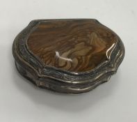 A silver hinge-lidded box, the lid set with hard stone medallion,
