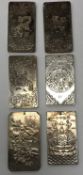 A set of four Chinese white metal Zodiac ingots including Rat, Dog, Snake and Dragon,