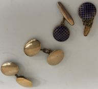A pair of 9 carat gold cufflinks of simple form, one with repair, bearing a 15 carat gold oval end,